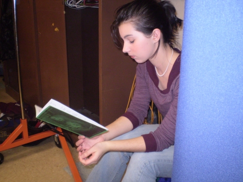 Amanda reading the program for "The Letter" in the Green Room.